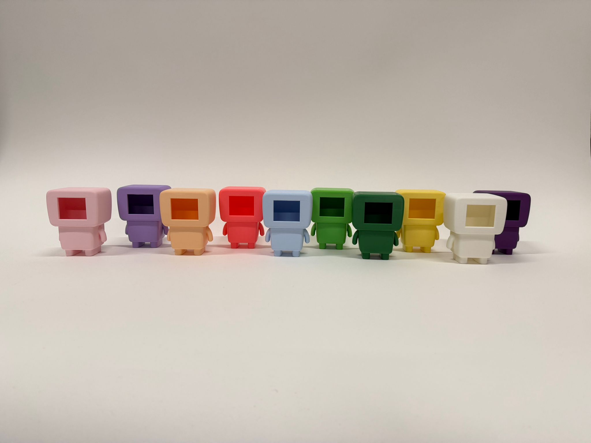 Ten nunu-xo robots in a row, seen from behind